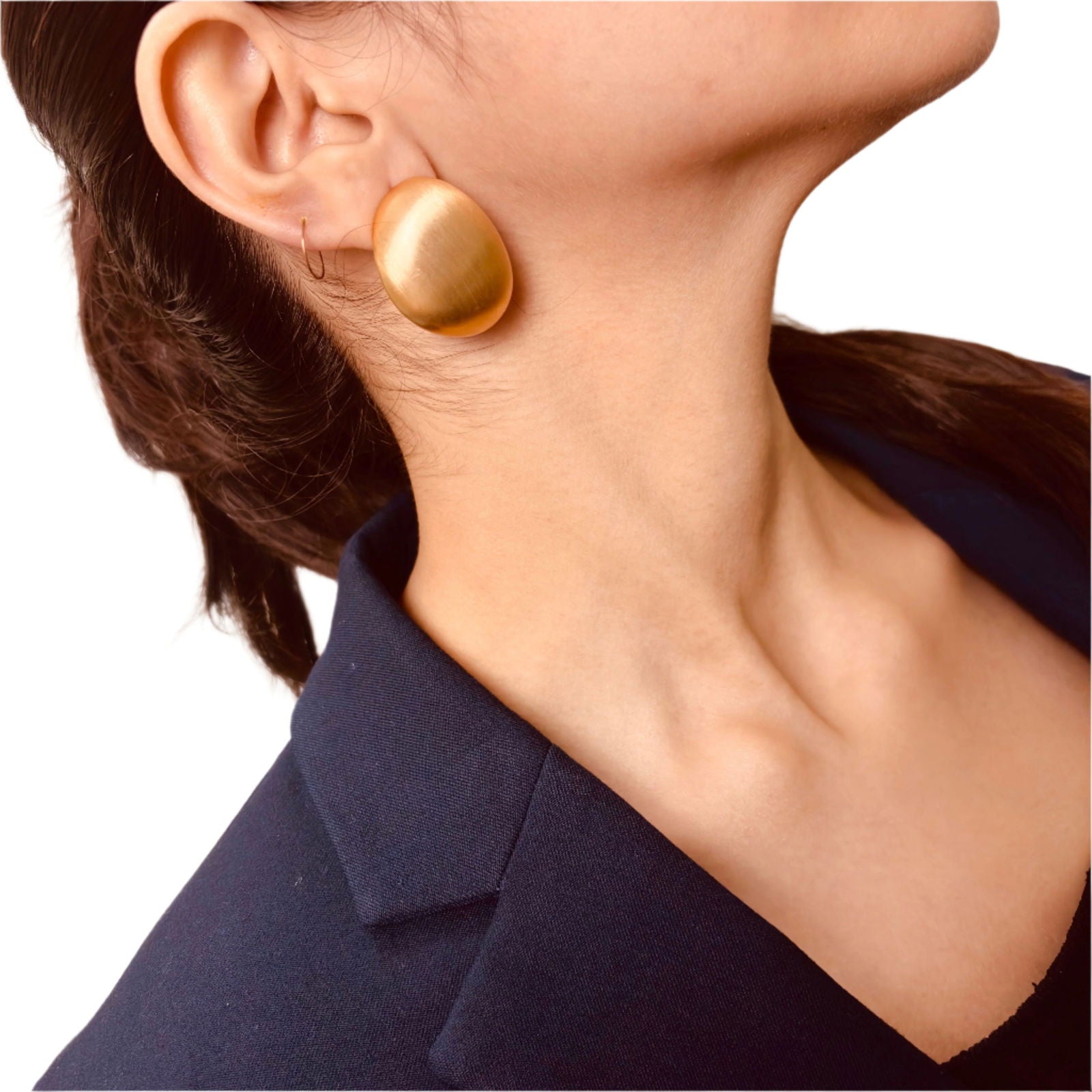 Model styling oval gold studs – sleek everyday elegance - dainty chic minimalist elegant gold plated earrings - hypoallergenic anti‑tarnish waterproof nickel‑free lead‑free gold plated earrings - scratch‑resistant fade‑resistant water‑resistant gold plated earrings