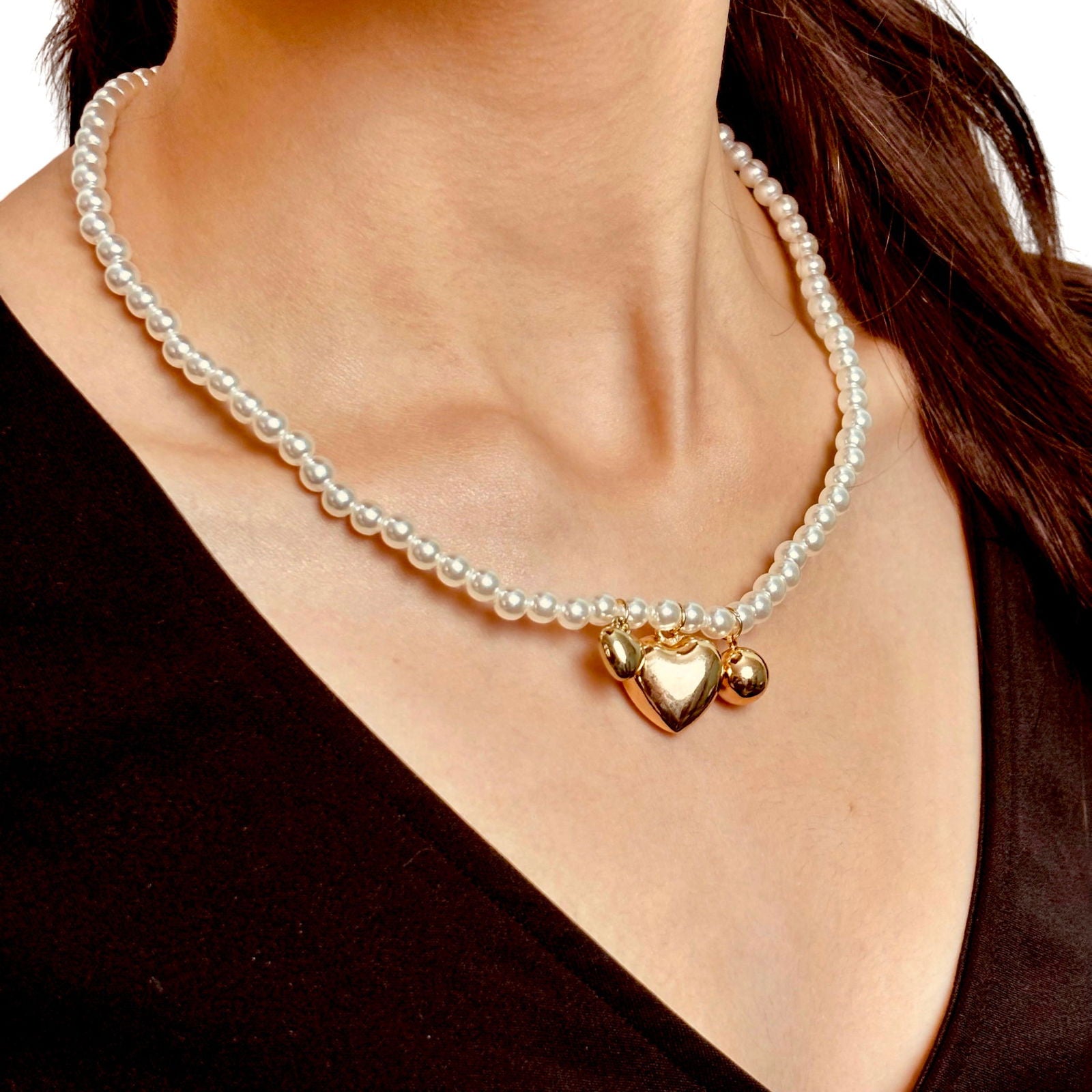 Model wearing chic anti-tarnish 18k gold plated three heart clustered pearl stainless steel necklace birthday gift for her ideas under 2000 - hypoallergenic clustered pearl heart necklace premium anniversary for her ideas under 2000 - waterproof 18K gold plated elegant necklace gift under 1500 - Rakhi gifts for sister under 2000 - jewelry Raksha Bandhan gifts - pearl necklace under 2000