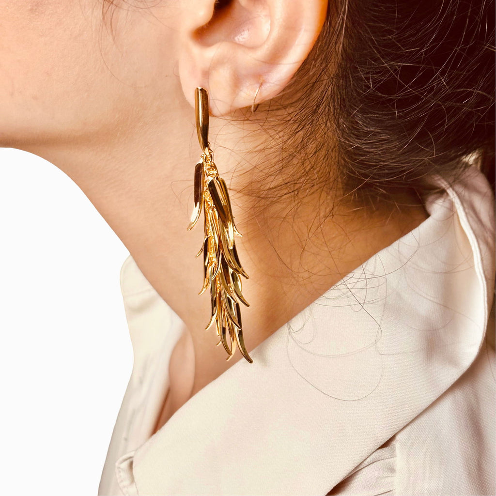 Model wearing long leaf tassel earrings - elegant classy design - Statement elegant gold plated earrings - hypoallergenic anti‑tarnish waterproof nickel‑free lead‑free gold plated earrings - scratch‑resistant fade‑resistant water‑resistant gold plated earrings