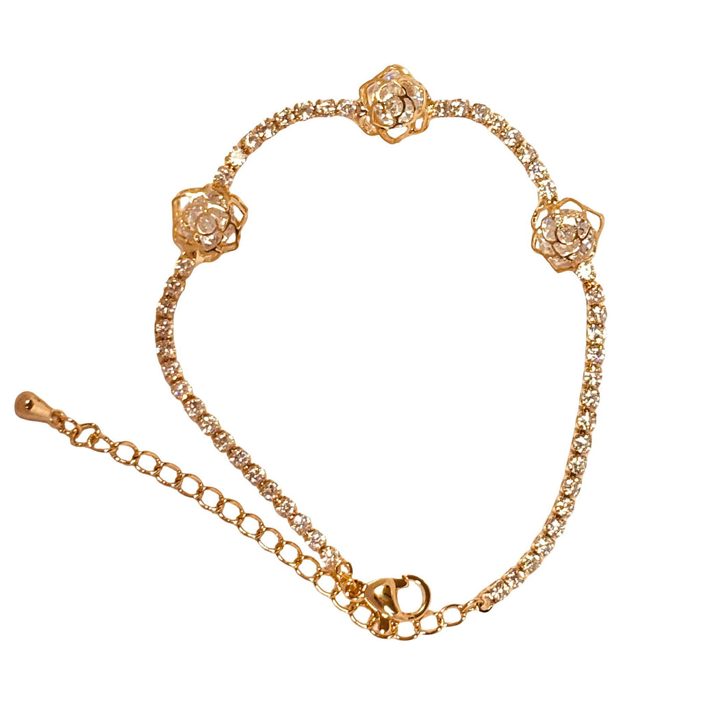 Flat-lay of multi-flower design cz tennis bracelet – elegant waterproof 18K gold plated cz tennis bracelet - hypoallergenic premium cz tennis bracelet gift for her under 2000 -  waterproof chic cz gold tennis bracelet anniversary gift under 2000 - affordable gold tennis bracelet stainless steel gift under 1500  - hypoallergenic cz tennis bracelet everyday wear - silver tennis bracelet gift for her - Rakhi gifts for sister under 2000 - jewelry Raksha Bandhan gifts