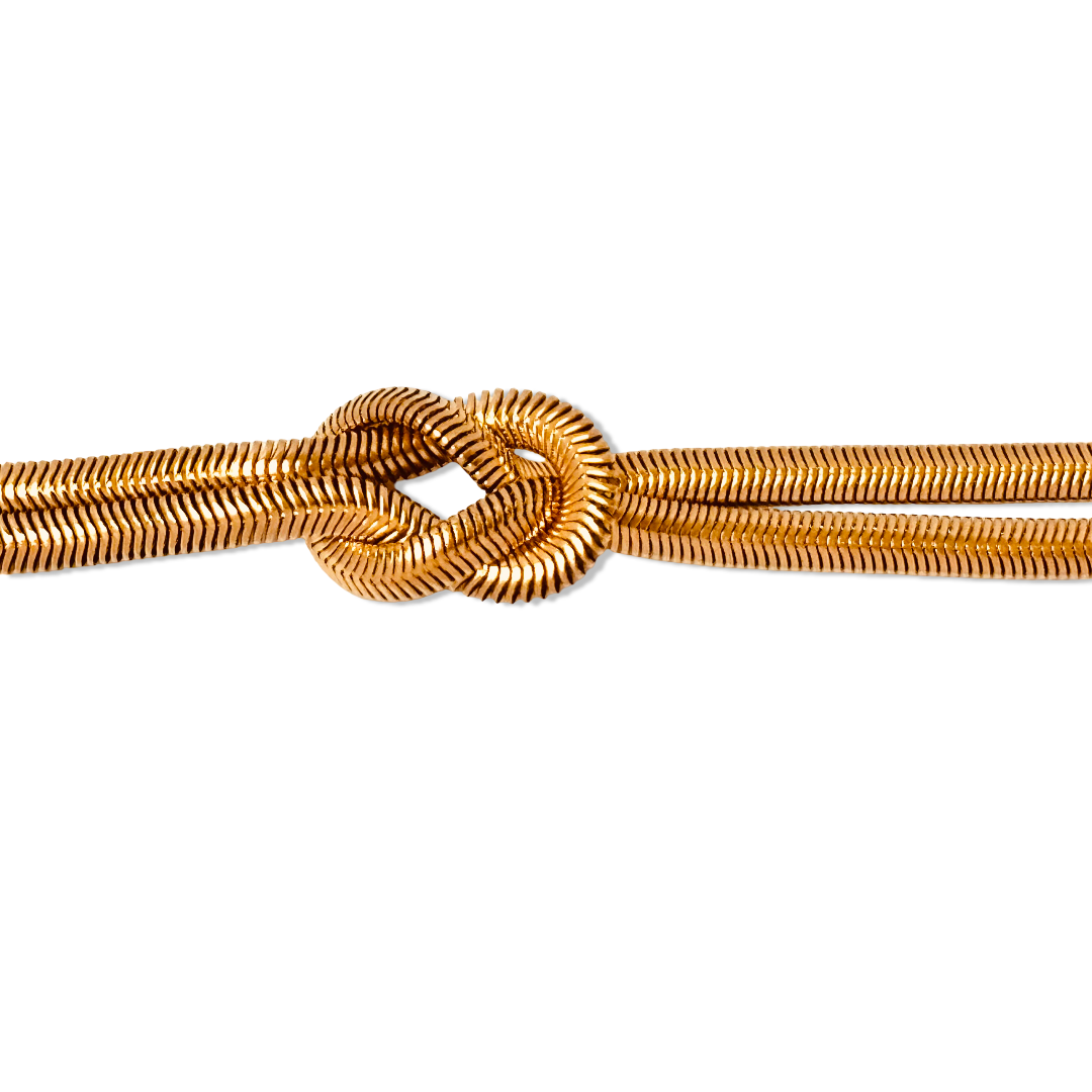 Close-up of snake chain texture and knotted center accent