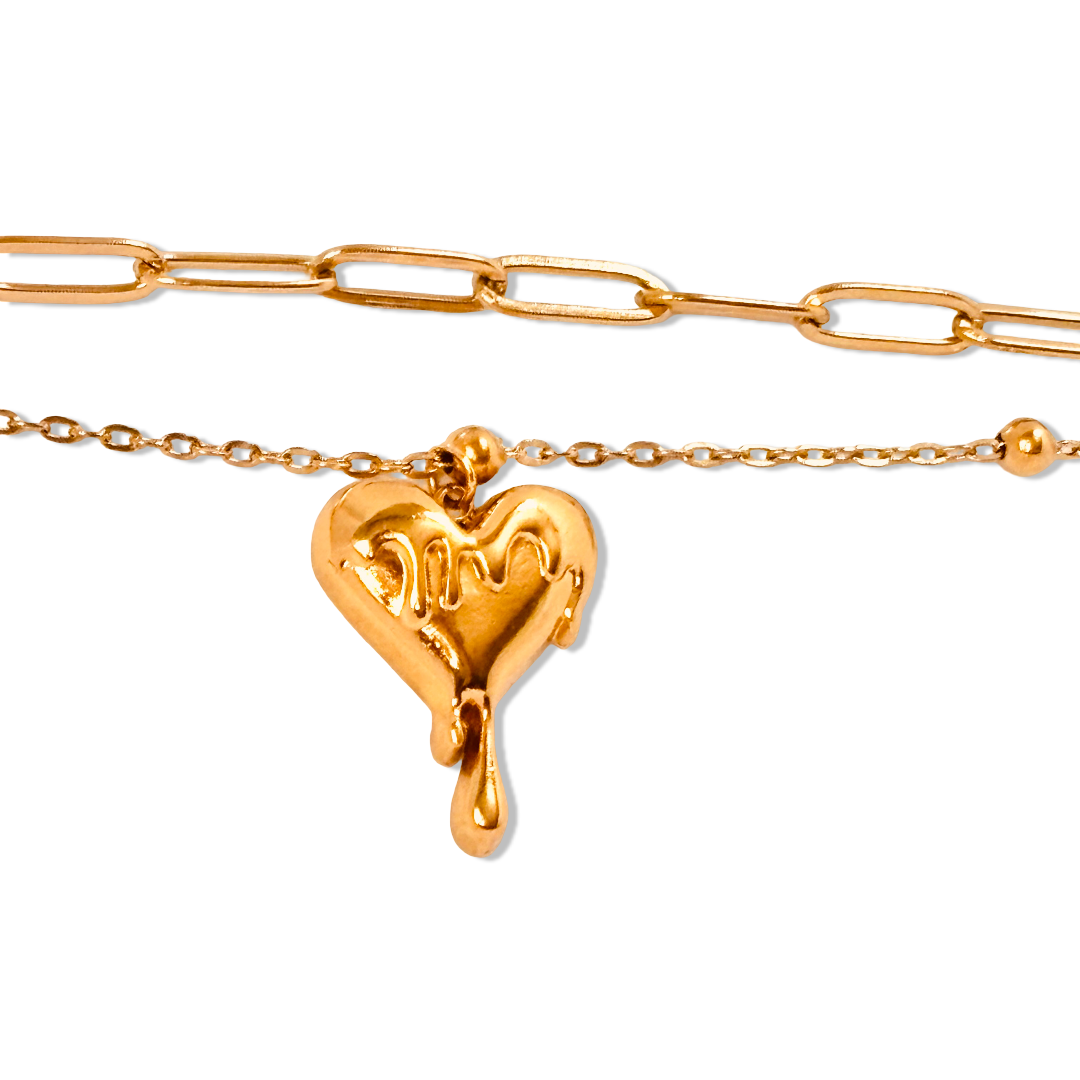 Close-up of melting heart charm and double chain design bracelet - chic and stylish