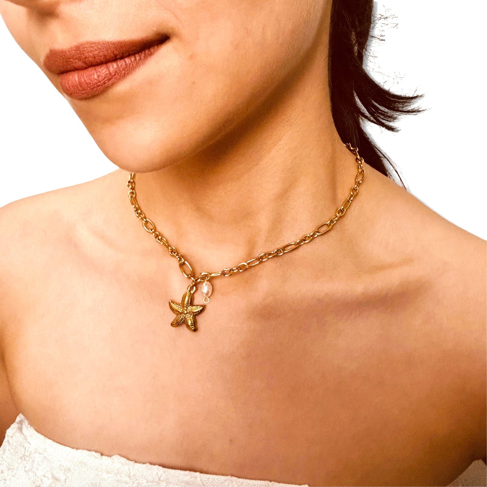 Model side angle shot of 18K gold plated starfish and baroque pearl minimal necklace stainless steel emphasizing starfish luster and link chain detail - dainty chic minimalist elegant gold plated necklace - hypoallergenic anti‑tarnish waterproof nickel‑free gold plated necklace