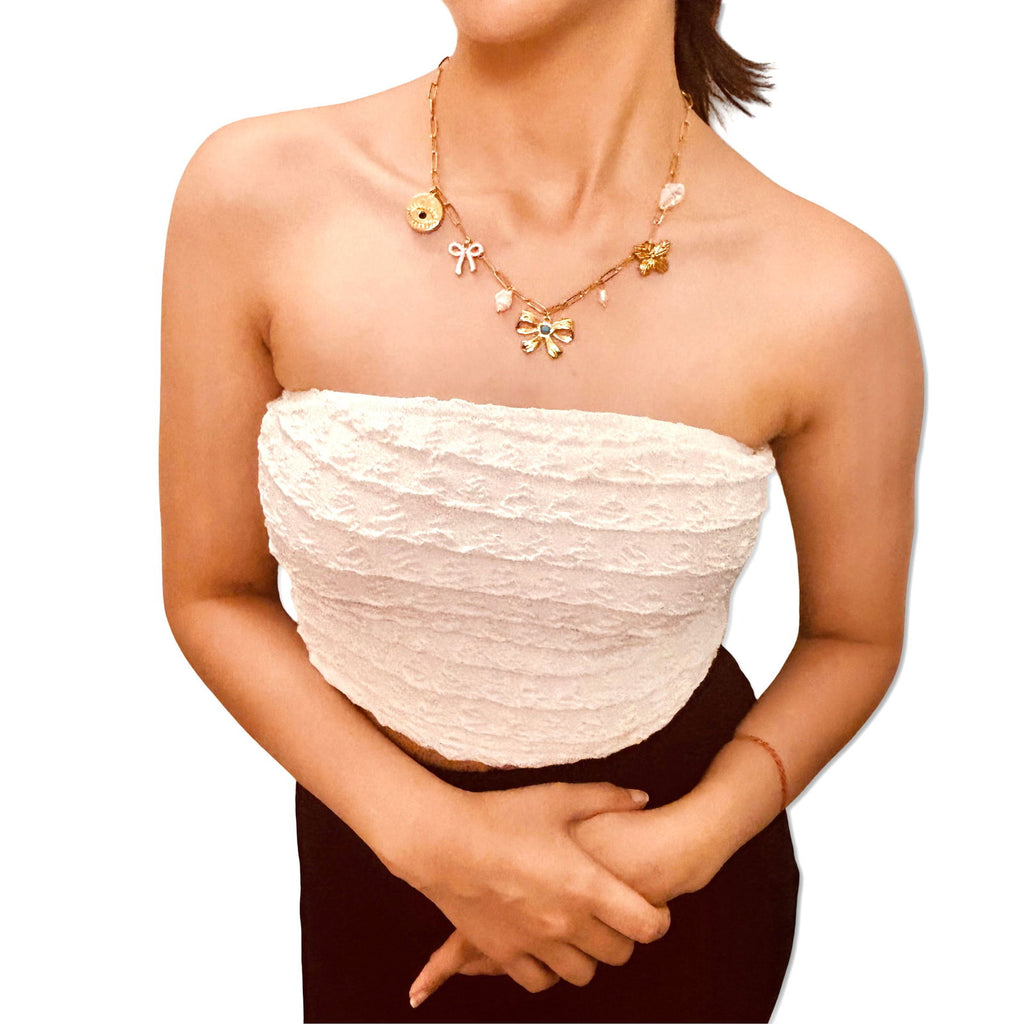 Model's front shot wearing anti-tarnish evil eye and bow charm gold-plated baroque pearl charm necklace birthday gift for her under 2000 - waterproof dainty minimalist gold plated stainless steel charm necklace anniversary gifts ideas under 2000 - hypoallergenic gold necklace festive gifts idea under 2000 - Rakhi gifts for sister under 2000 - jewelry Raksha Bandhan gifts