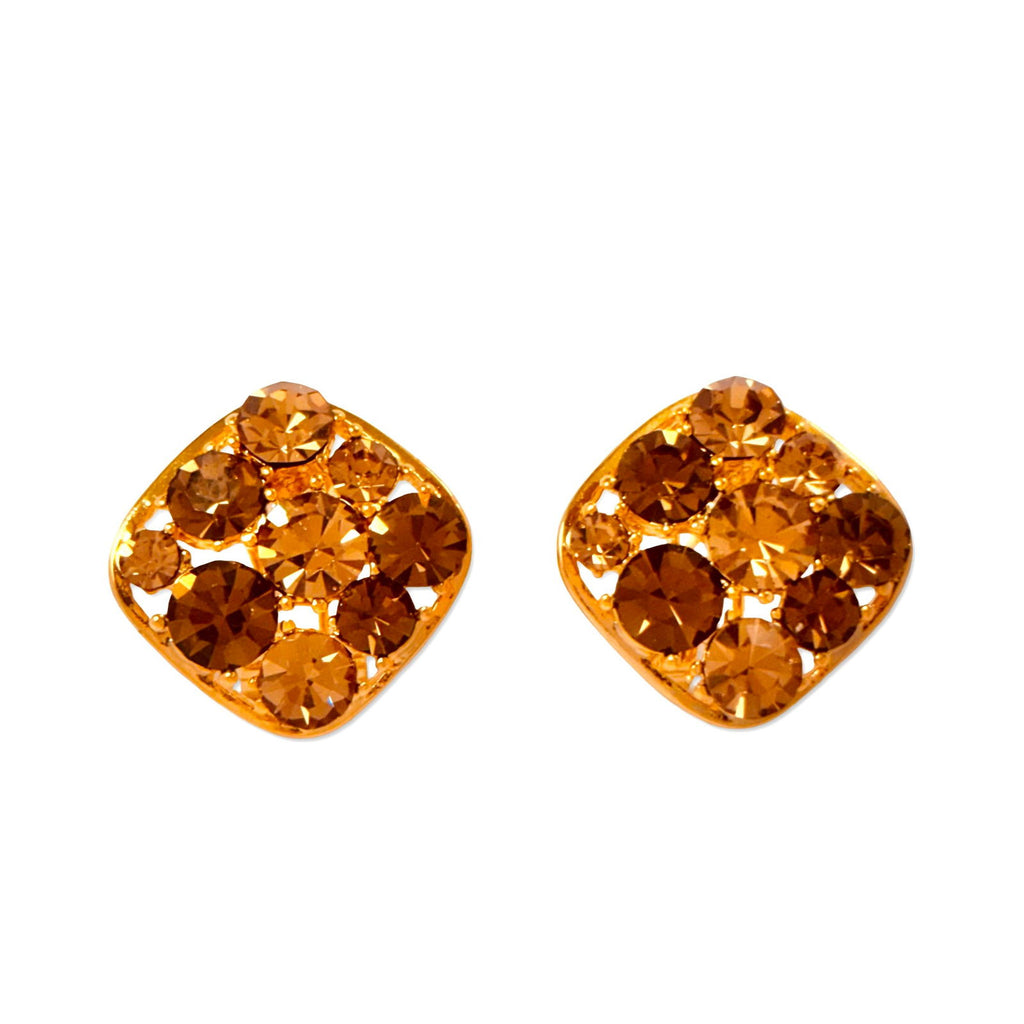 Flat lay on white background of waterproof festive Austrian crystal clip-on studs gold plated stainless steel earring gift for her under 2000 - anti tarnish premium 18K gold plated stainless steel crystal earrings festive gift for her under 2000 - hypoallergenic dainty 18K gold plated stainless steel earrings birthday anniversary gift for her under 1500 -  - Rakhi gifts for sister under 2000 - jewelry Raksha Bandhan gifts - gold studs under 1500