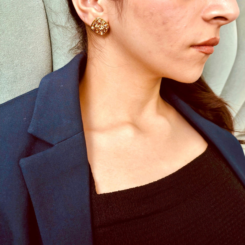 Model wearing brwon crystal studs - 18k gold plated premium earrings - geometric gold plated earrings - dainty statement and chic gold plated stud earrings - hypoallergenic anti‑tarnish waterproof nickel‑free lead‑free gold plated earrings - scratch‑resistant fade‑resistant water‑resistant gold plated earrings