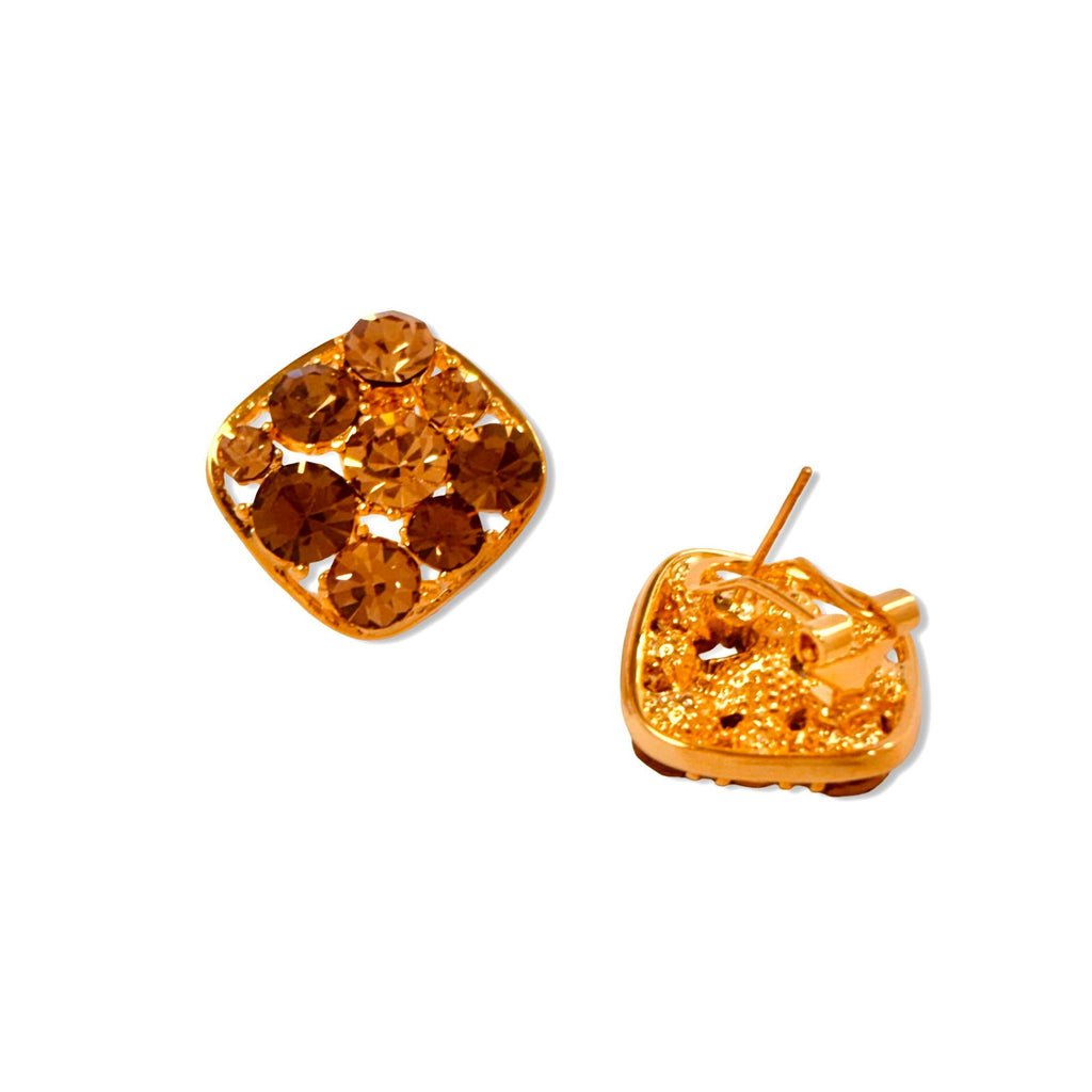 Flat-lay of austrian brown crystal studded clip-on studs showcasing clip-on detail and austrian crystals - dainty chic evening elegant gold plated earrings - hypoallergenic anti‑tarnish waterproof nickel‑free lead‑free gold plated earrings - scratch‑resistant fade‑resistant water‑resistant gold plated earrings