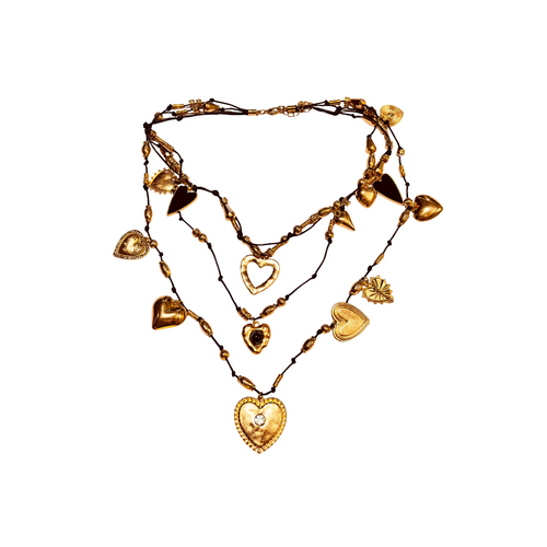 Flat-lay of black and golden heart necklace – modern mixed-metal look - triple layered necklace - boho trendy style