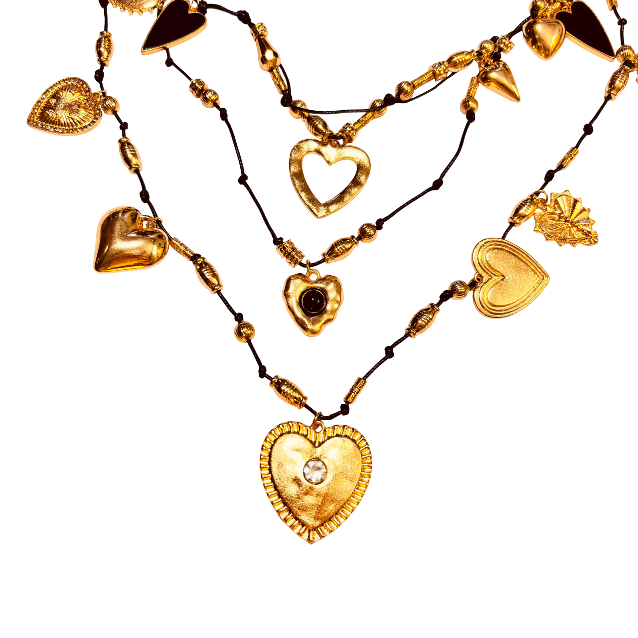 Close-up of heart links in matte black and polished gold finish