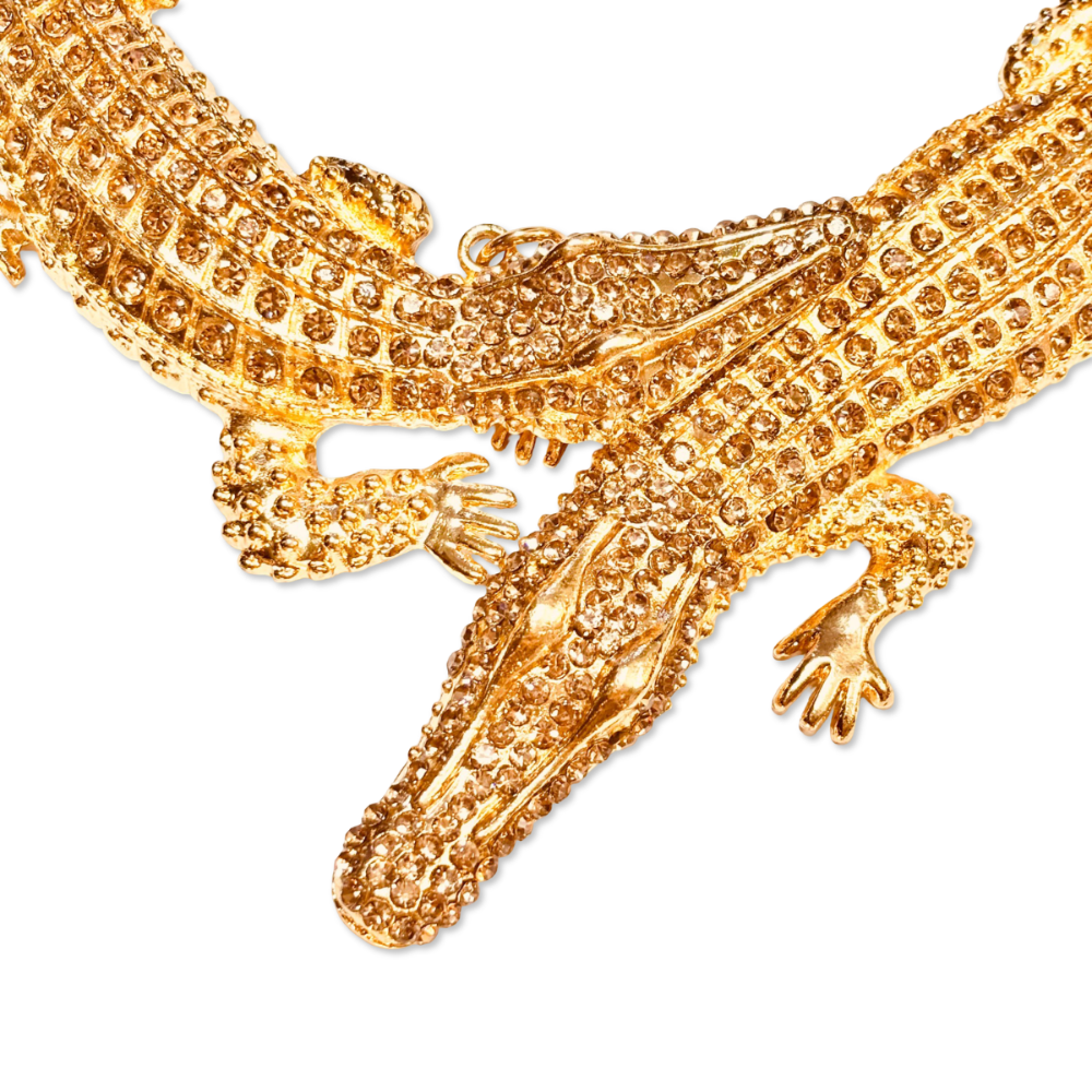 Close up shot of 18K gold-plated interlocked crocodile hasli laid flat on white background – luxurious choker design - Statement bold elegant  necklace - hypoallergenic anti‑tarnish waterproof nickel‑free necklace