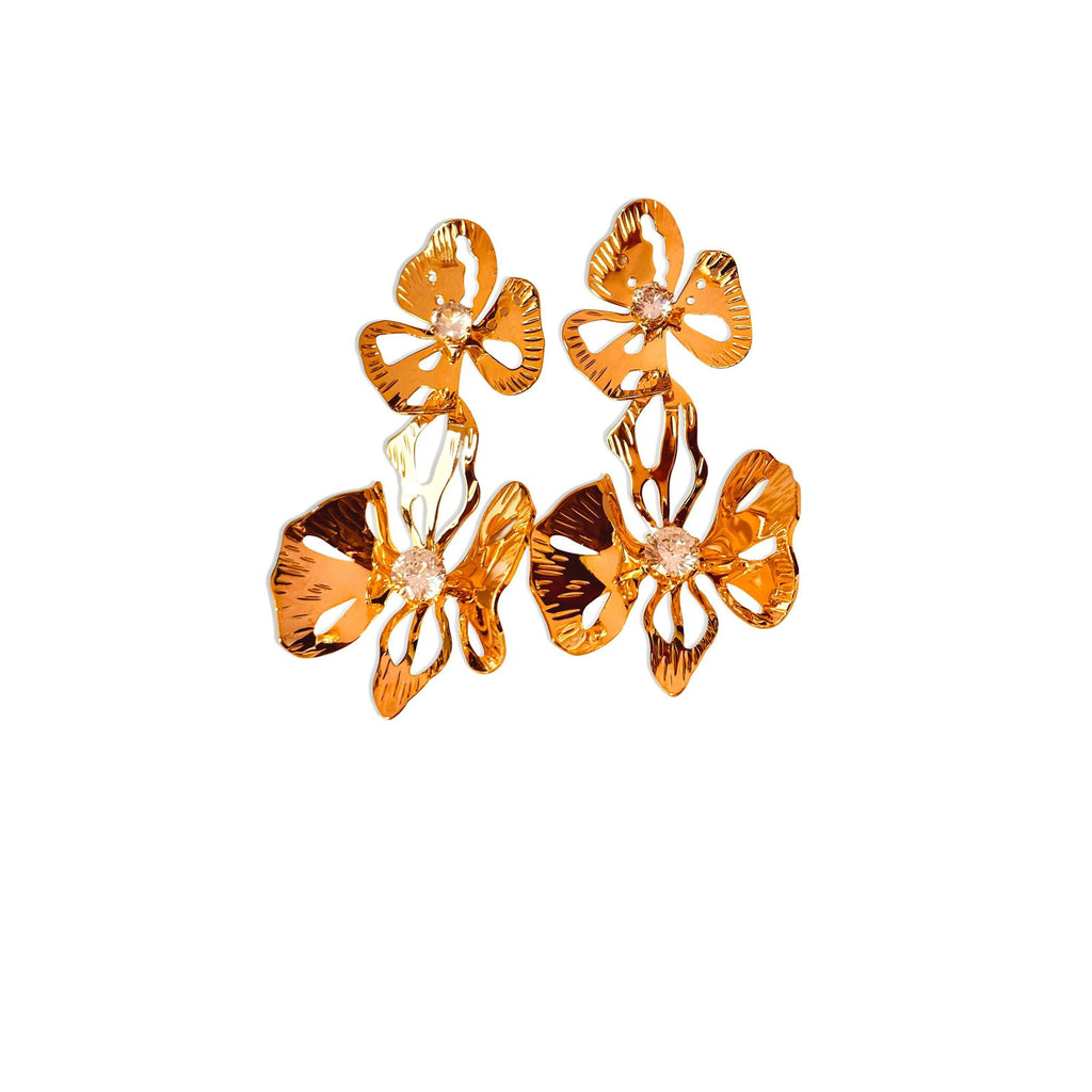 Flat-lay of large flower studs with reflective gold finish - Statement elegant gold plated earrings - hypoallergenic anti‑tarnish waterproof nickel‑free lead‑free gold plated earrings - scratch‑resistant fade‑resistant water‑resistant gold plated earrings