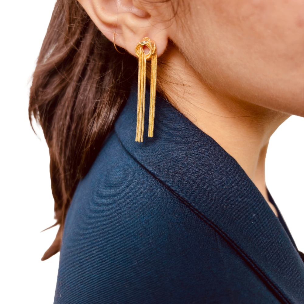 Model's side profile showing anti-tarnish trendy knot chain long earrings gift for her under 2000 - hypoallergenic 18K gold plated stainless steel statement dangle earrings birthday gift under 2000 - waterproof 18K gold plated tassel festive dangle party earrings anniversary gift for her under 2000 - Rakhi gifts for sister under 2000 - jewelry Raksha Bandhan gifts - gold earrings under 1500