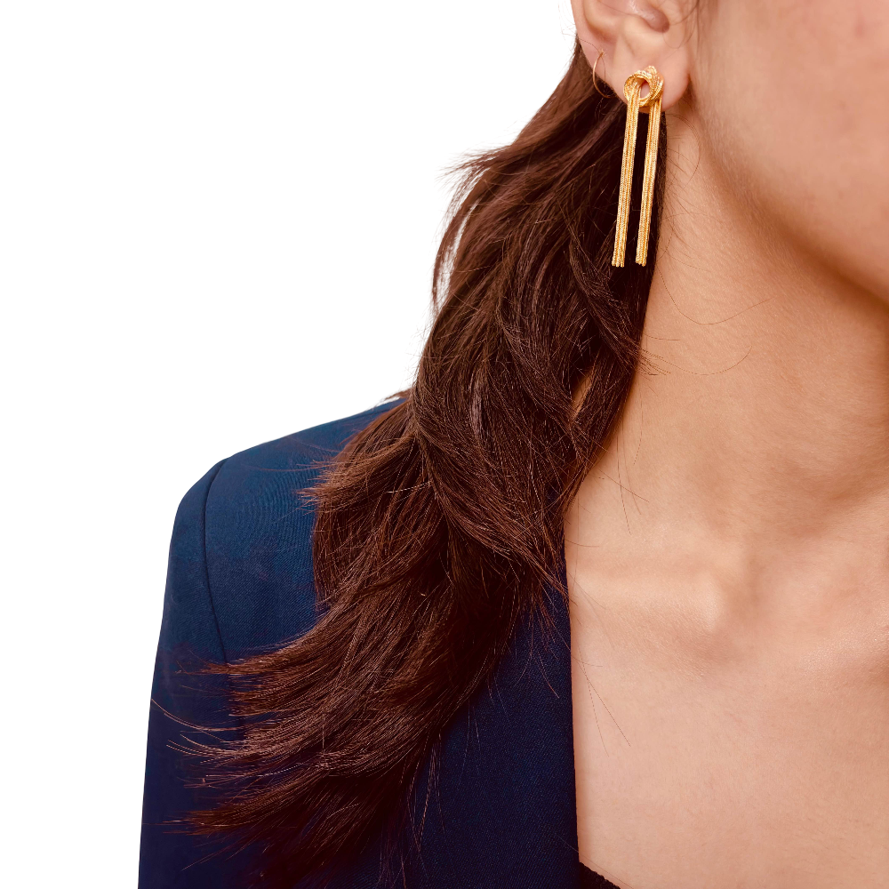 Model's front profile showing modern knot loop earrings – anti-tarnish 18K gold-plated jewelry