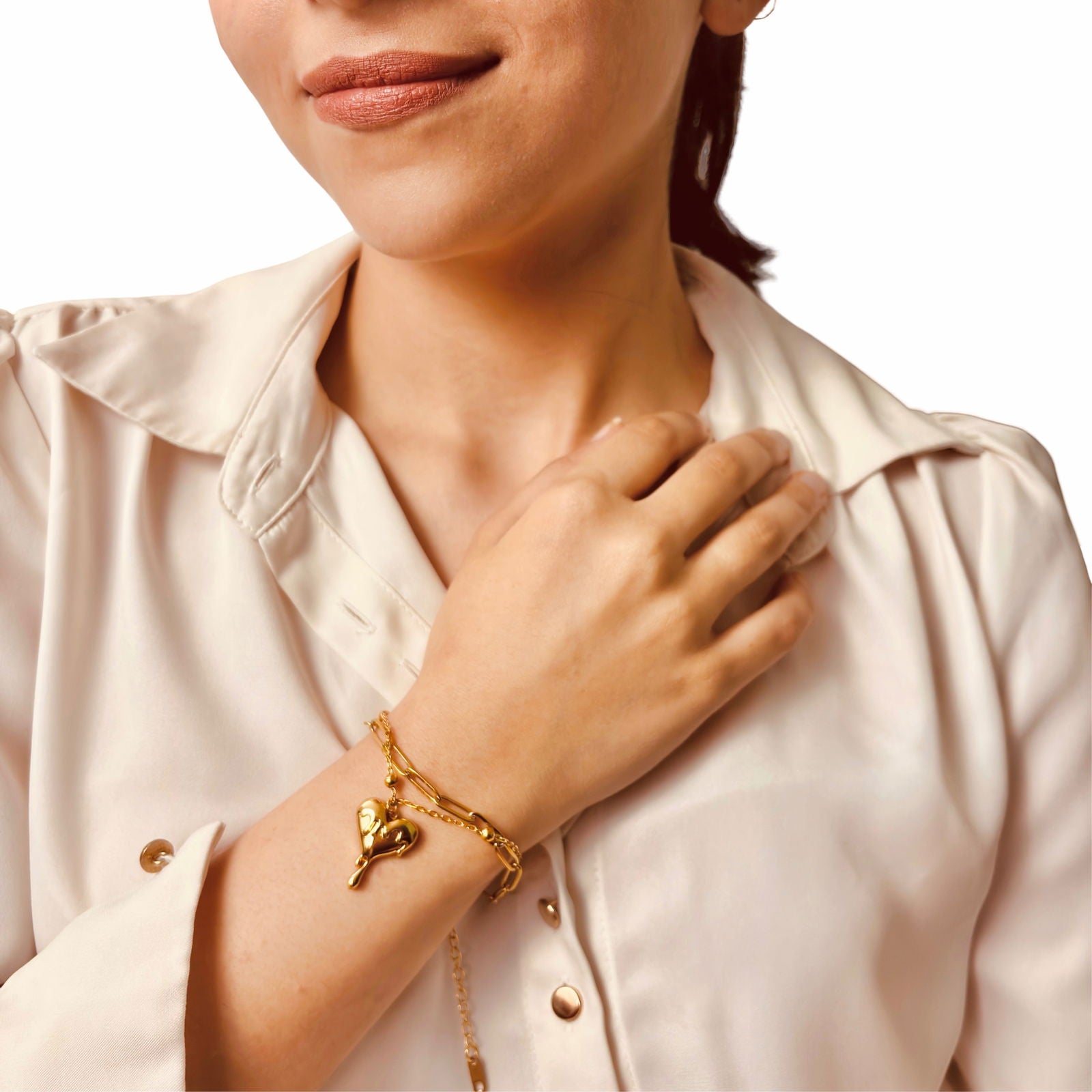 Model wearing anti-tarnish 18K gold plated stainless steel melting heart dainty bracelet birthday gift idea – fluid and romantic - waterproof minimalist 18K gold plated stainless steel heart bracelet under 2000 anniversary gift for her idea - hypoallergenic chic 18K gold plated stainless steel bracelet gift for her under 2000 - Rakhi gifts for sister under 2000 - jewelry Raksha Bandhan gifts - gold bracelet under 2000