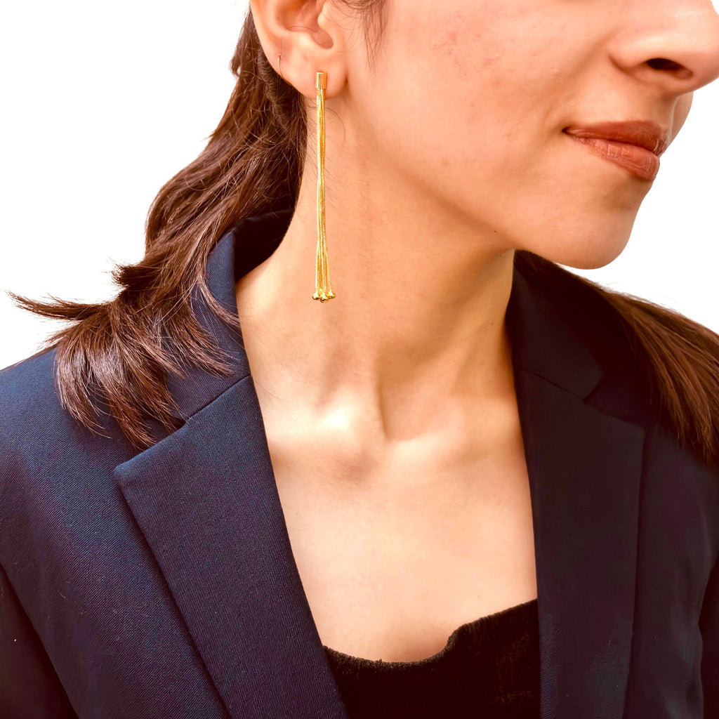Model's side profile of multi-chain tassel earrings - Statement bold elegant gold plated earrings - hypoallergenic anti‑tarnish waterproof nickel‑free lead‑free gold plated earrings - scratch‑resistant fade‑resistant water‑resistant gold plated earrings