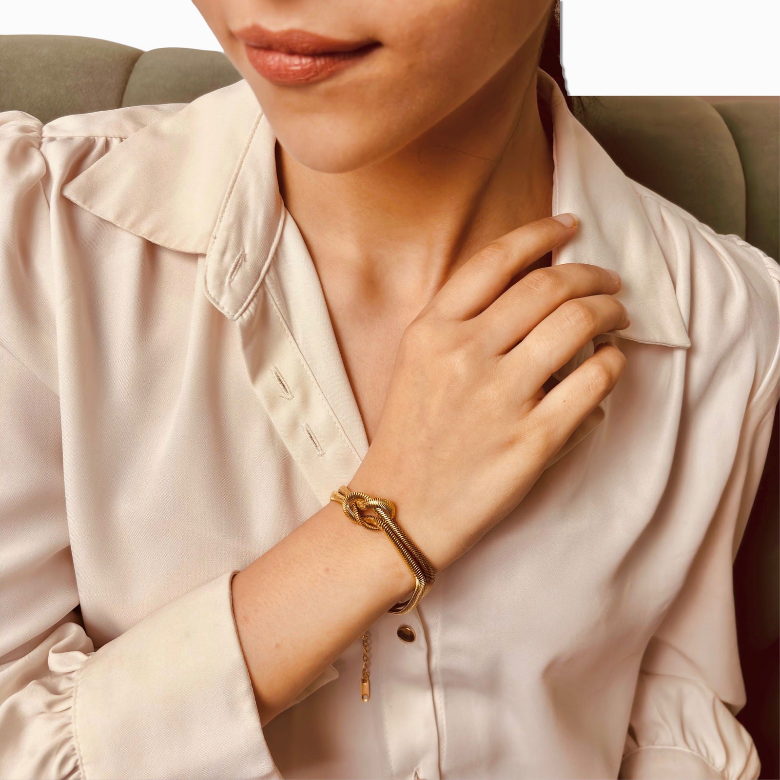 Model styling snake chain knot bracelet – sleek everyday gold piece - dainty chic minimalist elegant gold plated bracelet - hypoallergenic anti‑tarnish waterproof nickel‑free lead‑free gold plated bracelet