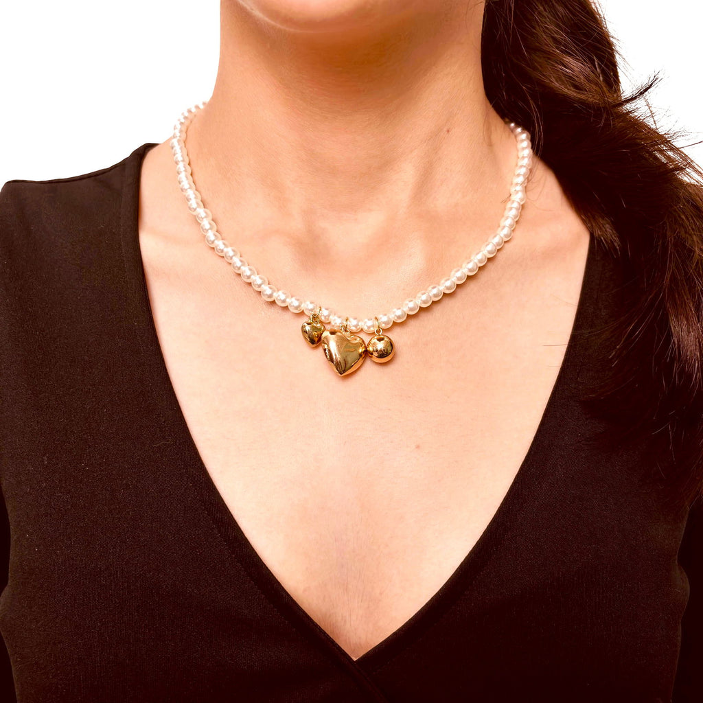 Triple Hearts Charm Pearl Necklace - Model wearing chic anti-tarnish 18k gold plated three heart clustered pearl stainless steel necklace birthday gift for her ideas under 2000 - hypoallergenic clustered pearl heart necklace premium anniversary for her ideas under 2000 - waterproof 18K gold plated elegant necklace gift under 1500 - Rakhi gifts for sister under 2000 - jewelry Raksha Bandhan gifts - pearl necklace under 2000