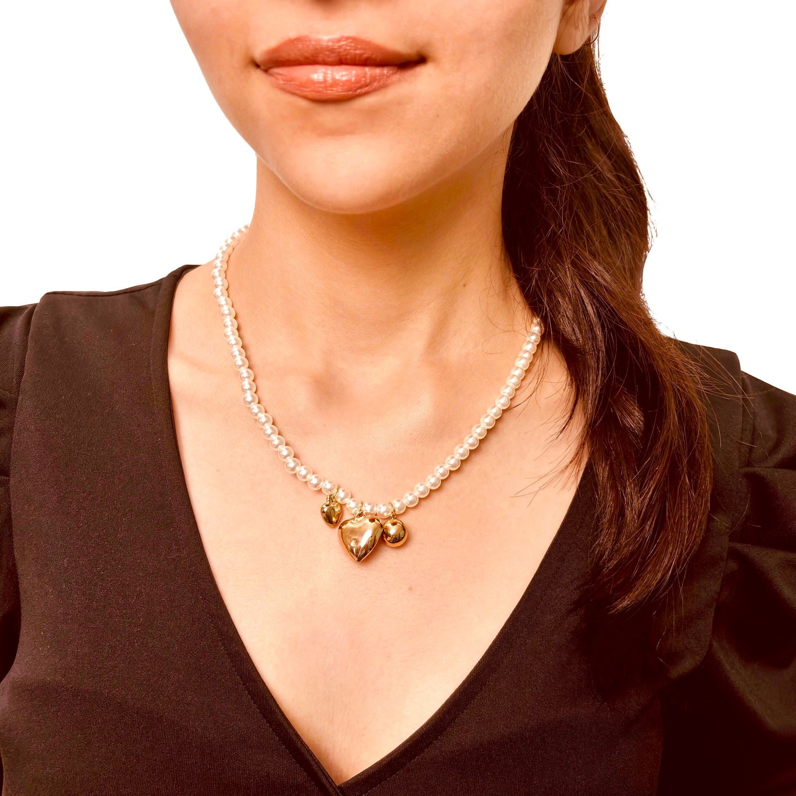 Model's front shot wearing chic anti-tarnish 18k gold plated three heart clustered pearl stainless steel necklace birthday gift for her ideas under 2000 - hypoallergenic clustered pearl heart necklace premium anniversary for her ideas under 2000 - waterproof 18K gold plated elegant necklace gift under 1500 - Rakhi gifts for sister under 2000 - jewelry Raksha Bandhan gifts - pearl necklace under 2000